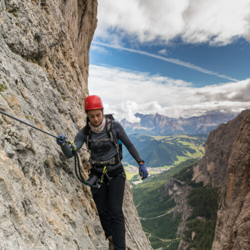 young-pretty-female-mountain-climber-on-a-via-ferr-2026-01-11-10-05-02-utc